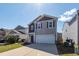Charming two-story home with gray and brown siding, a well-maintained lawn, and a driveway at 4809 Bushel Rd, Ladson, SC 29456