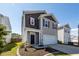 Beautiful two-story home with a well-manicured lawn and inviting front entrance at 4809 Bushel Rd, Ladson, SC 29456