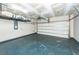 Spacious garage with painted floor, overhead storage, and ample room for vehicles at 4809 Bushel Rd, Ladson, SC 29456