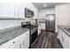 Well-equipped kitchen with granite countertops, stainless steel appliances, and ample cabinet space at 4809 Bushel Rd, Ladson, SC 29456