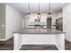 Modern kitchen featuring white cabinets, a large granite island, and stainless appliances at 4809 Bushel Rd, Ladson, SC 29456
