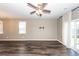 Spacious living room includes a ceiling fan and sliding door to let in plenty of light at 4809 Bushel Rd, Ladson, SC 29456