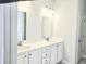 Bathroom featuring a double sink vanity with two mirrors and modern lighting at 482 Oak View Way, Summerville, SC 29483