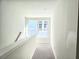 Hallway with a window, white walls, and carpet at 482 Oak View Way, Summerville, SC 29483