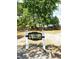 Community playground with a tree house and sign is surrounded by mature trees providing shade and a recreational space at 482 Oak View Way, Summerville, SC 29483