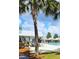A large community pool with lounge chairs and covered seating areas is surrounded by a well-maintained deck and landscaping at 482 Oak View Way, Summerville, SC 29483
