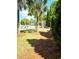 Resort style community pool with lounge chairs and landscaped walkway surrounded by palm trees and other mature plants at 482 Oak View Way, Summerville, SC 29483