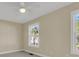 Bright bedroom featuring a ceiling fan, neutral paint, carpet and windows providing natural light and outdoor views at 4913 Lake Palmetto Ln, North Charleston, SC 29418