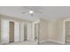 Spacious bedroom with open closet, neutral walls, carpet, and entry door at 4913 Lake Palmetto Ln, North Charleston, SC 29418