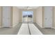 Bright bonus room featuring access to outdoor water view, carpet, with natural lighting at 4913 Lake Palmetto Ln, North Charleston, SC 29418