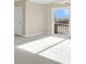 Spacious bonus room with sliding door, neutral walls, carpet, and ceiling fan at 4913 Lake Palmetto Ln, North Charleston, SC 29418