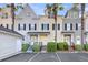 Charming townhouses with palm trees, well-maintained landscaping, and ample parking space in a well-kept community at 4913 Lake Palmetto Ln, North Charleston, SC 29418