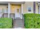 Inviting front entrance with a decorative glass door, manicured bushes, and visible house numbers for easy identification at 4913 Lake Palmetto Ln, North Charleston, SC 29418
