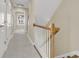 Inviting hallway with wood trim, white doors, and a staircase leading upstairs at 4913 Lake Palmetto Ln, North Charleston, SC 29418