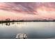 Stunning lake view from this home featuring a dock and a beautiful cloudscape above the water at 4913 Lake Palmetto Ln, North Charleston, SC 29418