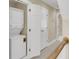 Convenient laundry area featuring a stacked washer and dryer, plus additional storage in hall closet at 4913 Lake Palmetto Ln, North Charleston, SC 29418