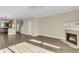 Spacious living area with fireplace, views to kitchen, and stairs leading to the next level at 4913 Lake Palmetto Ln, North Charleston, SC 29418