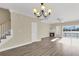 Expansive living room features staircase, fireplace, and sliding glass doors leading to a waterfront deck at 4913 Lake Palmetto Ln, North Charleston, SC 29418