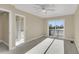 Spacious main bedroom with lake views, neutral carpet, ceiling fan and adjoining bath and balcony at 4913 Lake Palmetto Ln, North Charleston, SC 29418