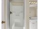 Clean, white shower enclosure with glass door, bronze hardware, and tile surround at 4913 Lake Palmetto Ln, North Charleston, SC 29418