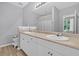 Bright bathroom with a double vanity and a large mirror at 500 Bucksley Ln # 308, Charleston, SC 29492