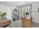 Office featuring modern desk, bookshelves, and natural light at 500 Bucksley Ln # 308, Charleston, SC 29492