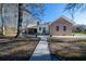 Beautiful backyard with a brick house, landscaped yard, and well-maintained lawn at 5367 Boone Run, Hollywood, SC 29449
