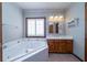 Bathroom featuring a large soaking tub, vanity, and tiled flooring at 5367 Boone Run, Hollywood, SC 29449