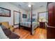 Bedroom featuring a dark wood four poster bed frame and hardwood floors at 5367 Boone Run, Hollywood, SC 29449