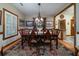Formal dining room featuring hardwood floors, a large wooden table, and beautiful decorative details at 5367 Boone Run, Hollywood, SC 29449