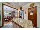 Kitchen featuring granite countertops, stylish flooring, and views into the formal dining room and other areas at 5367 Boone Run, Hollywood, SC 29449