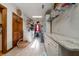 Bright laundry room with granite countertops, shelving, washer, dryer, and tiled flooring at 5367 Boone Run, Hollywood, SC 29449