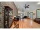 Spacious living room with hardwood floors, brick wall, ceiling fans and natural light at 5367 Boone Run, Hollywood, SC 29449