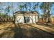 A backyard outbuilding with double doors surrounded by trees at 5367 Boone Run, Hollywood, SC 29449