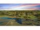 Picturesque aerial view of waterfront homes and docks at sunset at 5758 Chisolm Rd, Johns Island, SC 29455