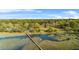 Picturesque aerial shot of a home with access to a private dock and stunning water views at 5758 Chisolm Rd, Johns Island, SC 29455