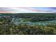 Expansive aerial view of lush landscapes, winding waterways, and natural beauty at 5758 Chisolm Rd, Johns Island, SC 29455
