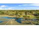 Beautiful aerial view showcasing a home with a private dock and serene waterfront at 5758 Chisolm Rd, Johns Island, SC 29455