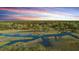 Breathtaking aerial view showcasing waterfront properties and private docks at 5758 Chisolm Rd, Johns Island, SC 29455