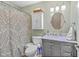 Charming bathroom with vanity, patterned shower curtain, and coordinated fixtures at 5758 Chisolm Rd, Johns Island, SC 29455