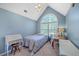 Bright bedroom featuring a large window, and coordinating furniture at 5758 Chisolm Rd, Johns Island, SC 29455