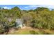 Aerial view of a gray home with beautiful, established landscaping at 5758 Chisolm Rd, Johns Island, SC 29455