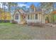 Lovely home exterior featuring a manicured lawn and blooming landscaping, perfect for curb appeal at 5758 Chisolm Rd, Johns Island, SC 29455