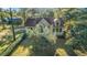 Charming two-story home featuring a landscaped yard with mature trees and a well-maintained lawn at 5758 Chisolm Rd, Johns Island, SC 29455