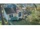 Inviting two-story home with well-manicured landscaping, trimmed hedges, and mature trees at 5758 Chisolm Rd, Johns Island, SC 29455