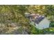 Aerial view of a house surrounded by trees and lush vegetation in a serene setting at 5758 Chisolm Rd, Johns Island, SC 29455