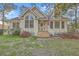 Inviting exterior with lush flowering shrubs, a welcoming entrance, and pristine landscaping at 5758 Chisolm Rd, Johns Island, SC 29455