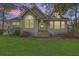 Charming home exterior boasting blossoming shrubs, a cozy entrance, and a well-kept lawn at 5758 Chisolm Rd, Johns Island, SC 29455