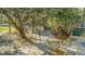 Detached two-car garage with deck, seating, and a spacious driveway offering additional parking at 5758 Chisolm Rd, Johns Island, SC 29455