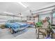 Spacious garage featuring multiple classic cars, well-lit interior, and organized storage solutions at 5758 Chisolm Rd, Johns Island, SC 29455